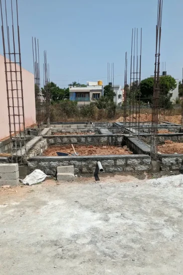 Foundation and plinth beam work during construction of the completed Krishnamurthy residence in Makali, Bangalore.