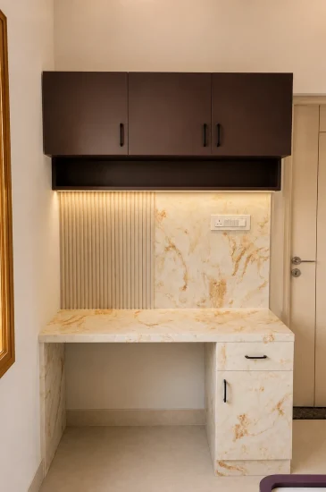 Study table at the Laxman residence in Rahuthnalli, Bangalore, with overhead cabinets and drawers.